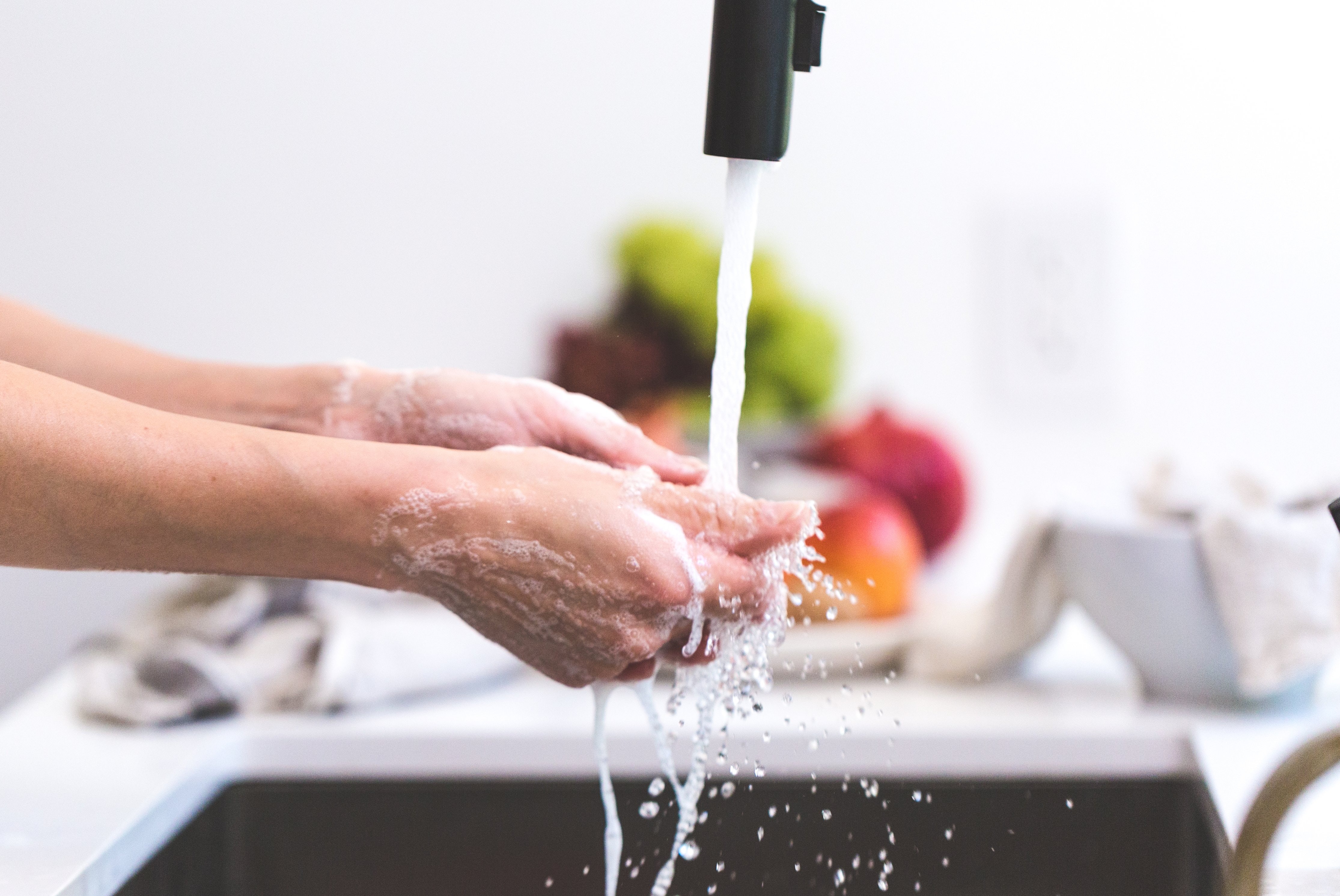 person with OCD washing hands